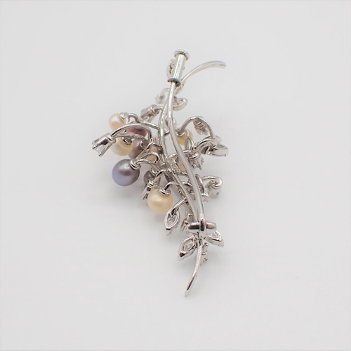 217 - A Cultured Pearl and Diamond Spray Brooch set cultured pearls in various colours amongst marquise an... 