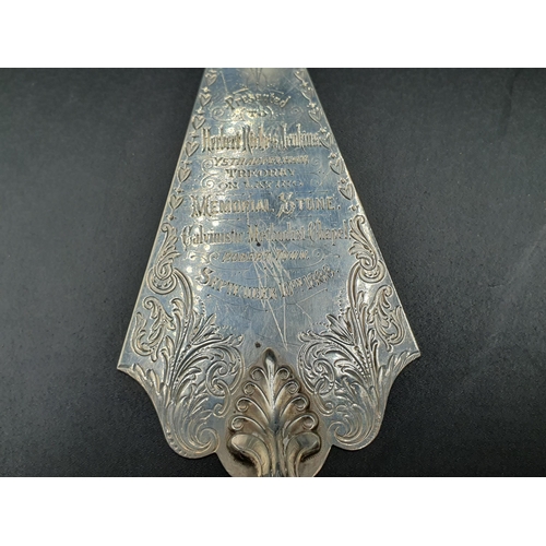 22 - A Victorian silver Trowel Blade with presentation inscription, London 1888, another plated, and an o... 