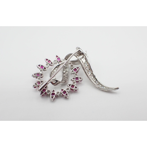 231 - A Ruby and Diamond Wreath and Ribbon Brooch  claw and pavé-set throughout with round rubies and bril... 