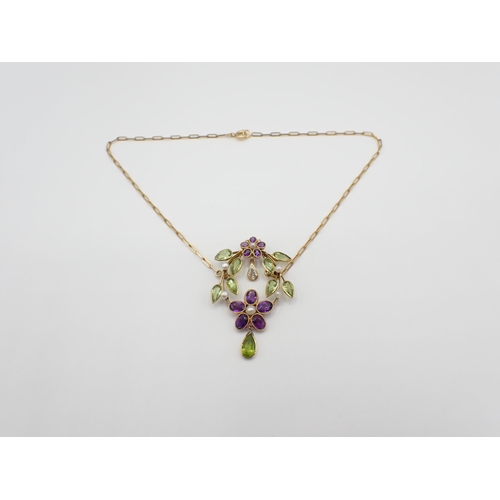 235 - A Diamond, Peridot, Amethyst and Seed Pearl Necklace formed as flowers and leaves on oval frame mill... 