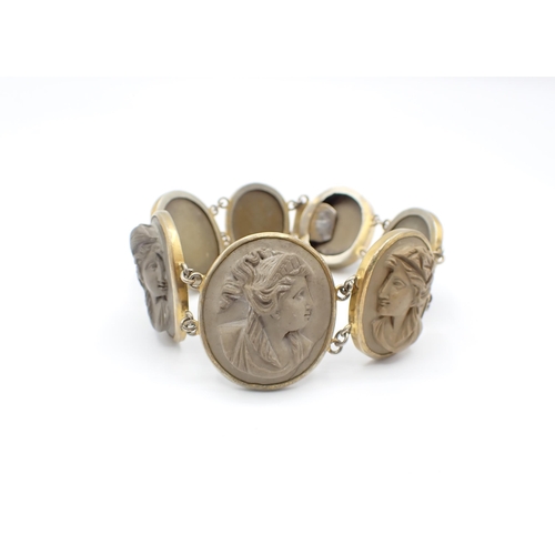 243 - A Lava Cameo Bracelet the seven graduated links each carved bust in profile in gilt metal