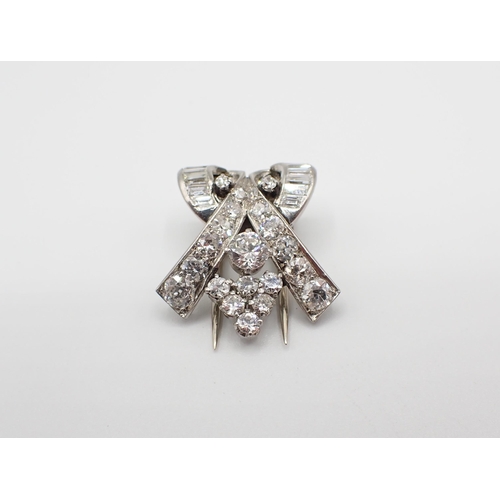 244 - An Art Deco Diamond Clip claw, channel and pavé-set old and baguette-cut stones, approx 4.80gms, 22m... 