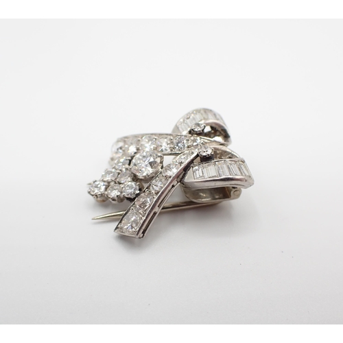 244 - An Art Deco Diamond Clip claw, channel and pavé-set old and baguette-cut stones, approx 4.80gms, 22m... 