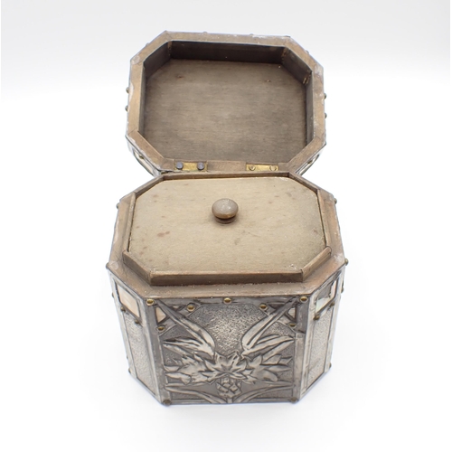 275 - An Arts and Crafts octagonal pewter Tea Caddy embossed flowers with mother of pearl inlay, 4 1/2in x... 