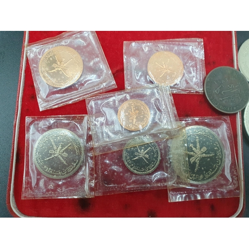 298 - A Muscat and Oman 1970 Specimen Coin Set in case of issue with certificate, along with a silver Riya... 