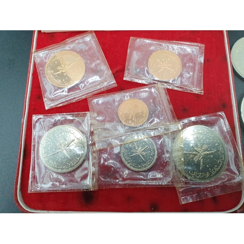 298 - A Muscat and Oman 1970 Specimen Coin Set in case of issue with certificate, along with a silver Riya... 