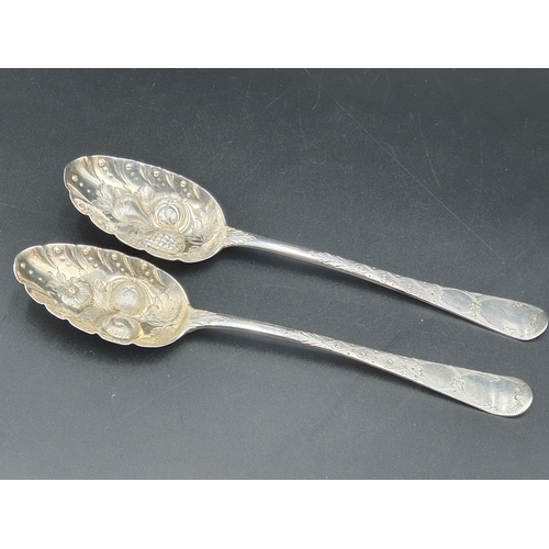 31 - Two Georgian silver Berry Spoons Hanoverian pattern with fruit embossed bowls, London 1806 & 1824