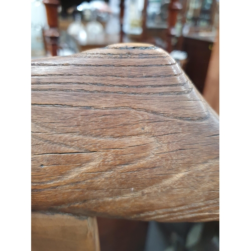 345 - A pair of Chinese yoke-back elm Chairs, the shaped splats with carved roundels and shaped arms, 3ft ... 