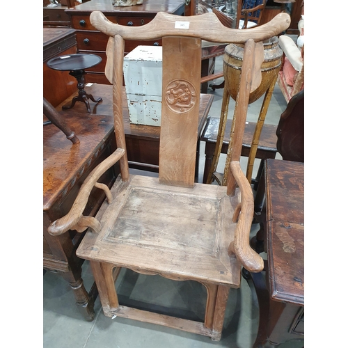 345 - A pair of Chinese yoke-back elm Chairs, the shaped splats with carved roundels and shaped arms, 3ft ... 