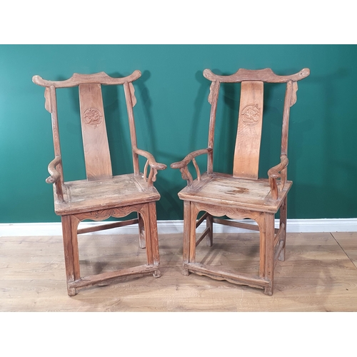 345 - A pair of Chinese yoke-back elm Chairs, the shaped splats with carved roundels and shaped arms, 3ft ... 