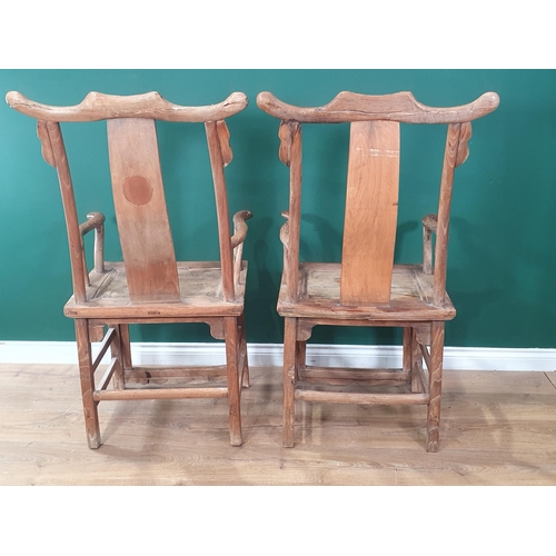 345 - A pair of Chinese yoke-back elm Chairs, the shaped splats with carved roundels and shaped arms, 3ft ... 