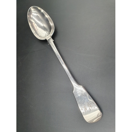 35 - A Victorian silver Basting Spoon fiddle pattern engraved initials, London 1863, maker: G Adams