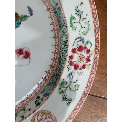 355 - A 19th Century Chinese Charger with floral design within green border surrounded by a frieze of flow... 