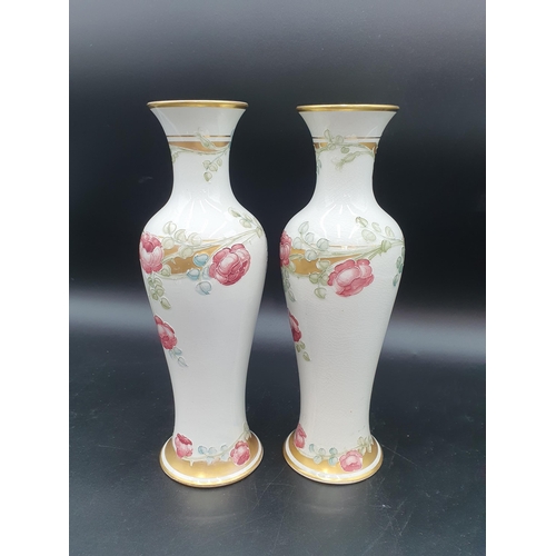 373 - A pair of Wm Moorcroft MacIntyre slender baluster Vases with tube lined floral decoration in pink, g... 