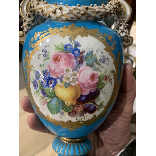 384 - A pair of Sevres style Vases with scroll handles, oval panels painted sprays of flowers on pedestal ... 