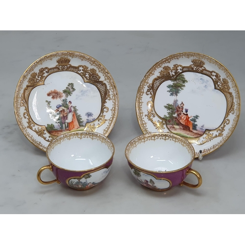 392 - A near pair of Dresden Cabinet Cups and Saucers, the cups with scenes of figures in landscapes on pu... 