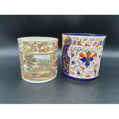 395 - A Crown Derby Mug with Imari colours, floral and leafage scroll designs on a blue ground, 5in H and ... 