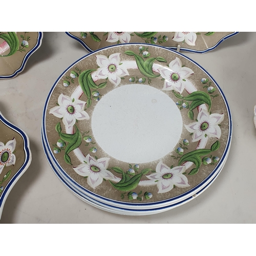 399 - An early 19th Century Pearlware part Dessert Service with borders of flowers and leaves on a grey gr... 