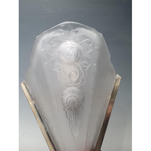 405 - A pair of Art Deco Wall Lights, with moulded frosted glass shades with shaped tops and raised floral... 