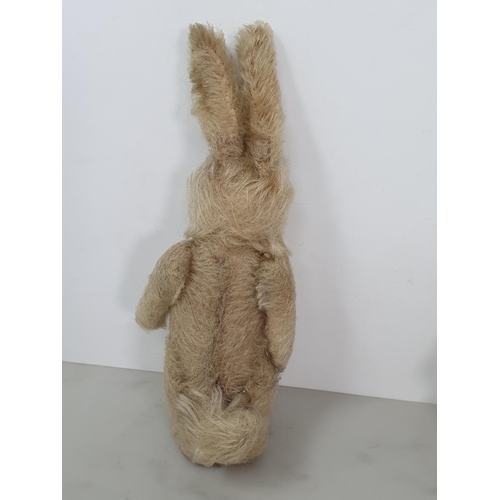 411 - An antique mohair Rabbit with glass eyes 8in H and a small antique Teddy Bear 5 1/2in H