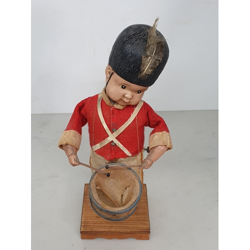 416 - A Japanese clockwork Automaton of a Drummer Boy in bearskin hat in working order (drum skin torn) 11... 