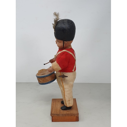 416 - A Japanese clockwork Automaton of a Drummer Boy in bearskin hat in working order (drum skin torn) 11... 