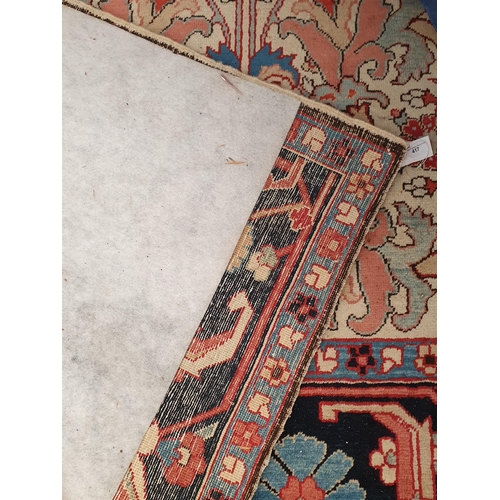 417 - A large modern Carpet with leafage design on cream ground within blue border 13ft 1in L x 10ft 4in W