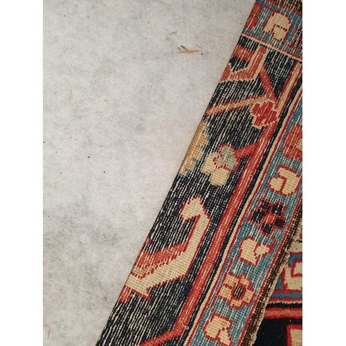 417 - A large modern Carpet with leafage design on cream ground within blue border 13ft 1in L x 10ft 4in W