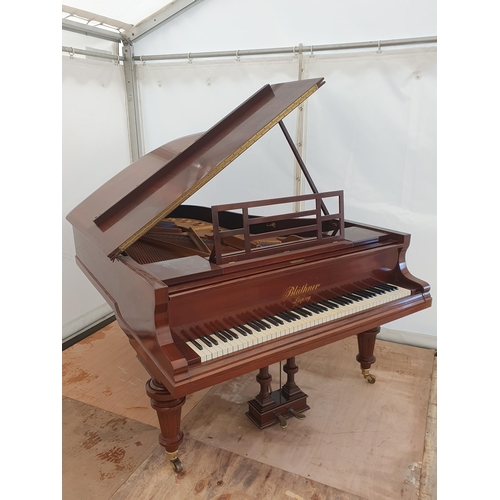 421 - A rosewood Boudoir Grand Piano by Bluther No.72579, raised on reeded turned supports and brass caste... 