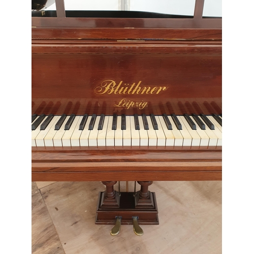 421 - A rosewood Boudoir Grand Piano by Bluther No.72579, raised on reeded turned supports and brass caste... 