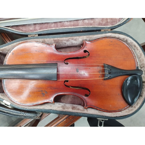 423 - A Nicolas Mathaeu full size Violin with two piece back and including two bows in case