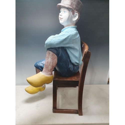 427 - A painted fibreglass Figure of a boy in clogs 2ft 7in H