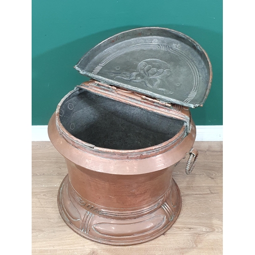 431 - A large Art Nouveau copper Log Cauldron, circular with hinged cover, ring handles and Art Nouveau de... 