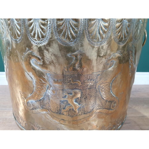 435 - A Victorian brass and copper Log Cauldron with lion mask ring handles, with embossed coats of arms o... 