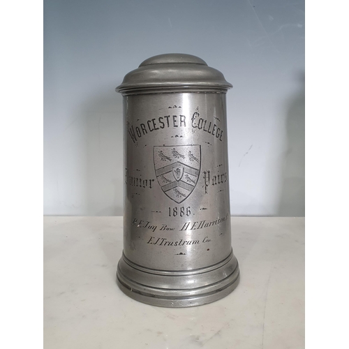 437 - A set of four 19th Century Pewter Rowing Tankards with glass bases for Worcester College dated 1886,... 