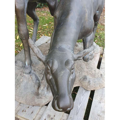 439 - An impressive alloy bronze effect Sculpture of a pair of Red Deer (one antler A/F) 4ft 10in H x 4ft ... 