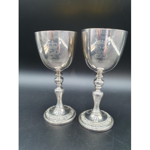 45 - A pair of Elizabeth II silver Limited Edition Silver Wedding Goblets on baluster columns decorated f... 