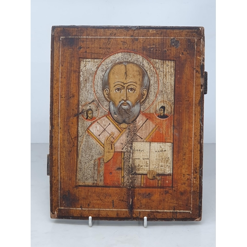 458 - A painted Russian Icon depicting 'Saint Nicholas' on wooden board, 10½in High x 8½in Wide