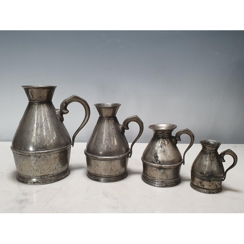 464 - A set of four pewter graduated Haystack Measures stamped Austen & Son of Cork (also with a copy of P... 