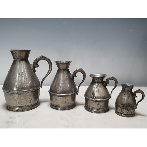 464 - A set of four pewter graduated Haystack Measures stamped Austen & Son of Cork (also with a copy of P... 