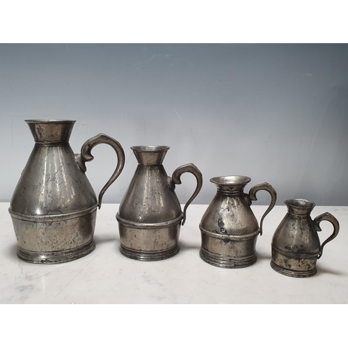 464 - A set of four pewter graduated Haystack Measures stamped Austen & Son of Cork (also with a copy of P... 