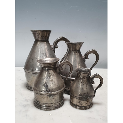 464 - A set of four pewter graduated Haystack Measures stamped Austen & Son of Cork (also with a copy of P... 