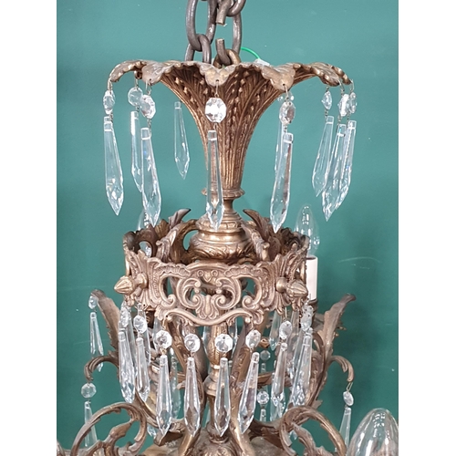 471 - A brass four branch, twelve sconce Electrolier with prismatic glass drops, 2ft 2in H