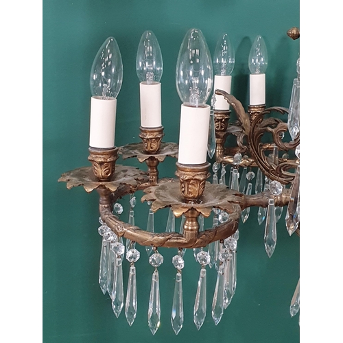 471 - A brass four branch, twelve sconce Electrolier with prismatic glass drops, 2ft 2in H