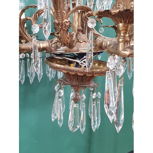 471 - A brass four branch, twelve sconce Electrolier with prismatic glass drops, 2ft 2in H