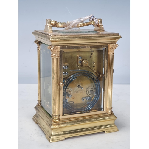 484 - A French brass cased Carriage Clock with moulded handle, Corinthian columns on moulded base, white e... 