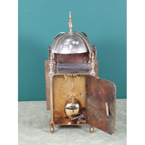 486 - An antique Lantern Clock with bell surmount, arched brass dial, silvered chapter ring, pierced and e... 