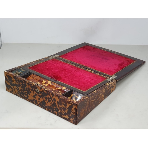 493 - A 19th Century tortoiseshell Writing Slope, the hinged lid enclosing red velvet writing surface, and... 