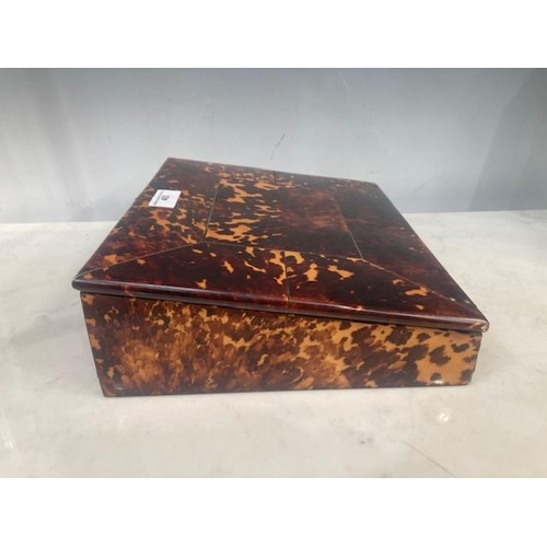 493 - A 19th Century tortoiseshell Writing Slope, the hinged lid enclosing red velvet writing surface, and... 