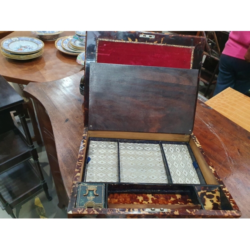 493 - A 19th Century tortoiseshell Writing Slope, the hinged lid enclosing red velvet writing surface, and... 